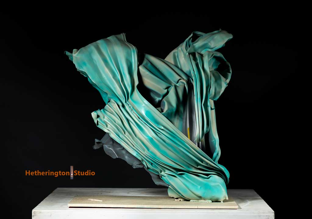 Crashing wave steel sculpture — side angle