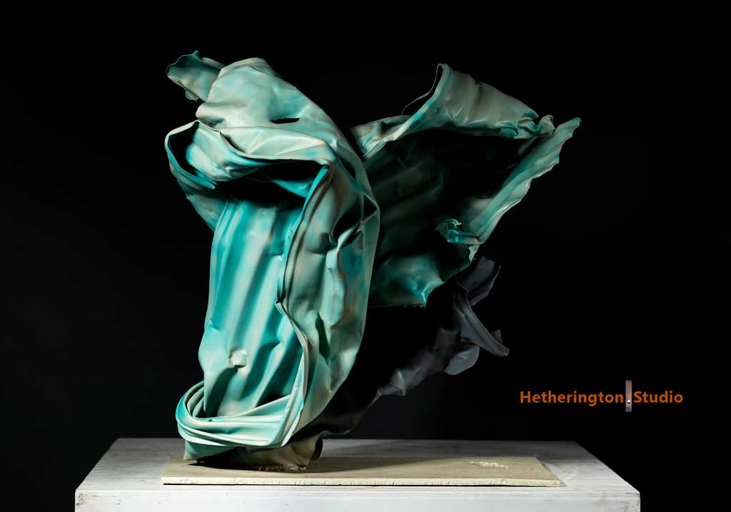 Crashing wave steel sculpture — weathered steel texture