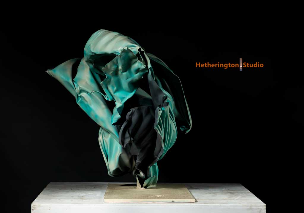 Crashing wave steel sculpture — base detail